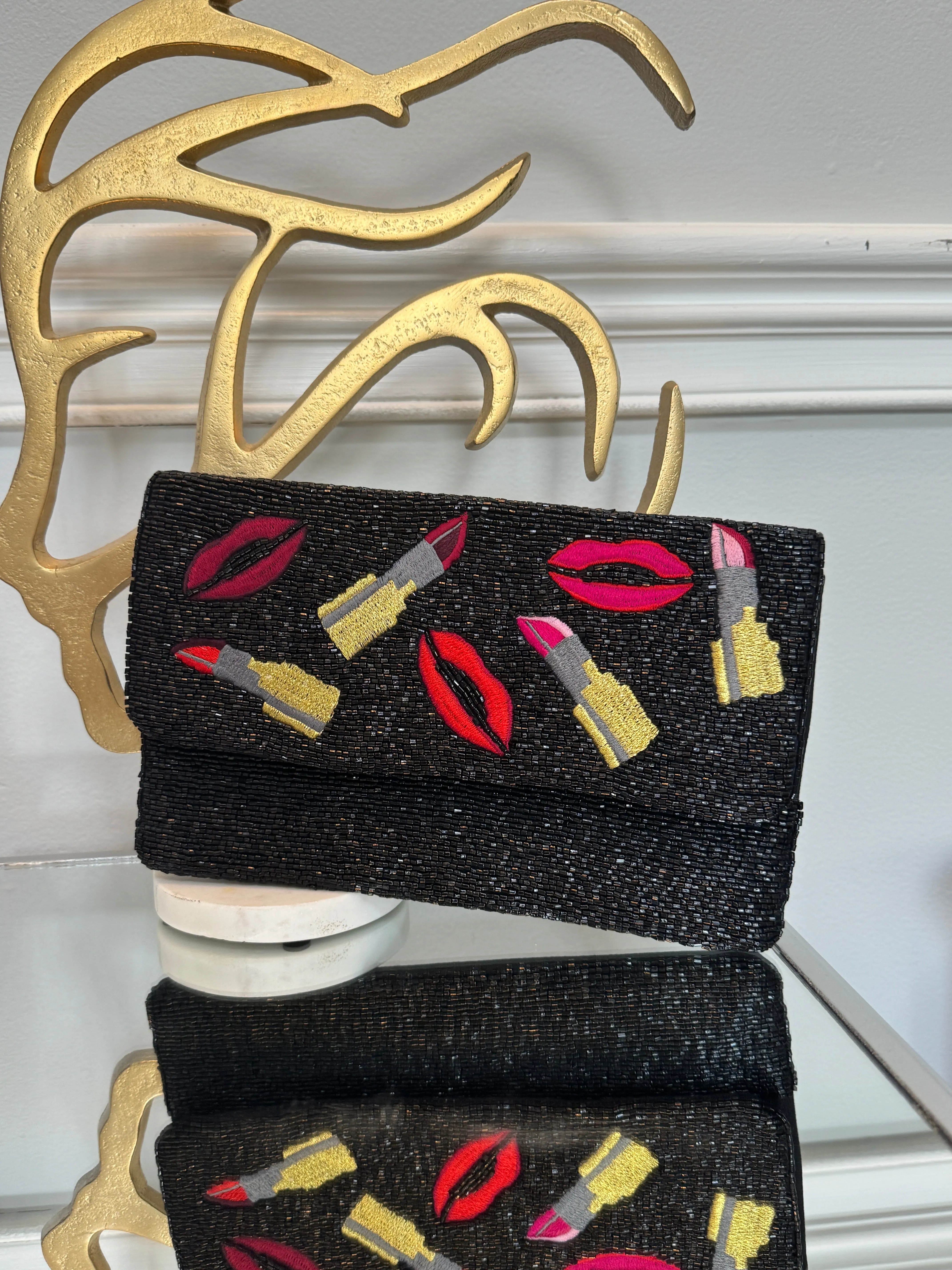 Black beaded & colored embroidery design clutch.